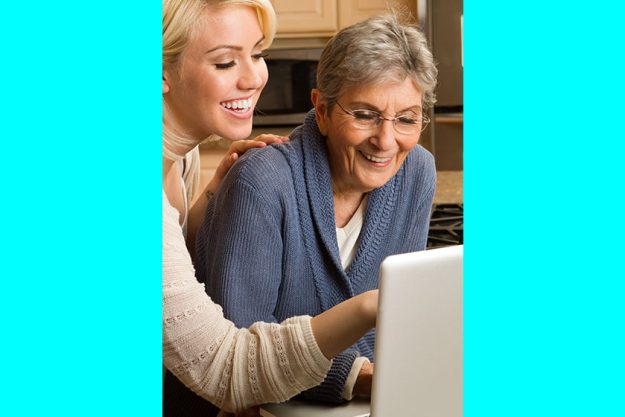 granddaughter helping her grandmother on the computer granddaughter helping her grandmother on the computer