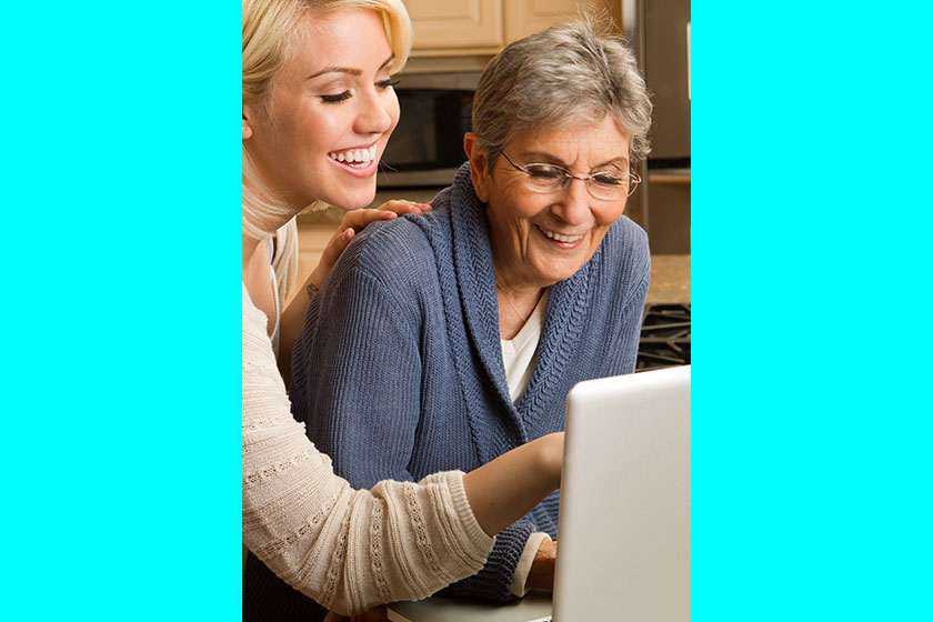 granddaughter helping her grandmother on the computer granddaughter helping her grandmother on the computer