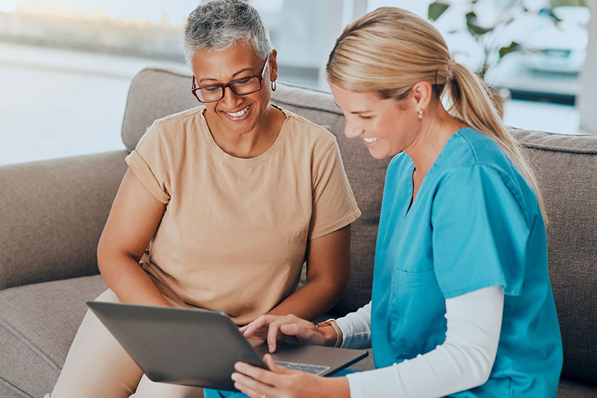 laptop healthcare assisted living woman nurse talking test results retirement laptop healthcare assisted living woman nurse talking test results retirement