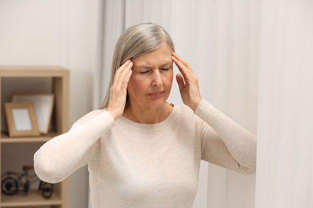 menopause woman suffering headache home menopause woman suffering headache home