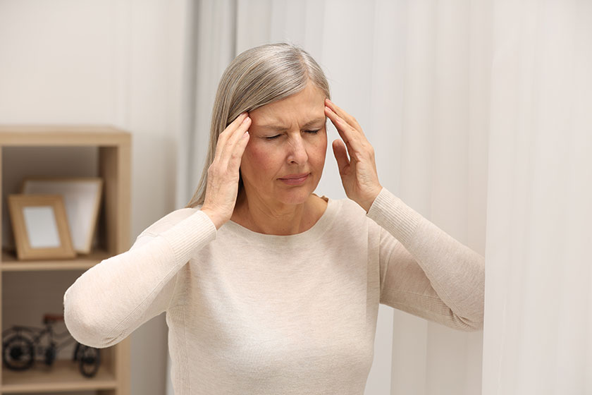 menopause woman suffering headache home