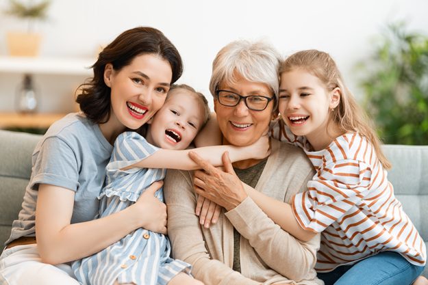 nice girls mother grandmother enjoying spending time together home