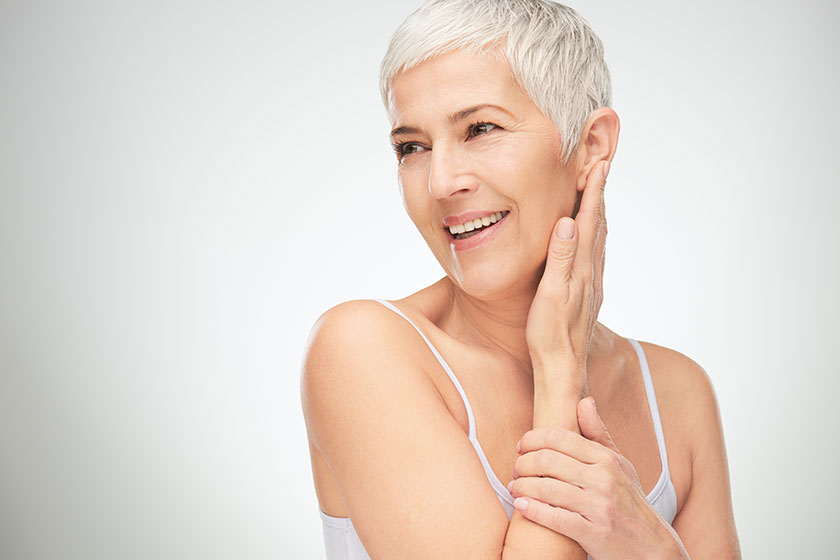 portrait of beautiful senior woman in front of white background