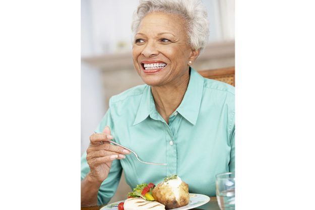 woman enjoying meal home