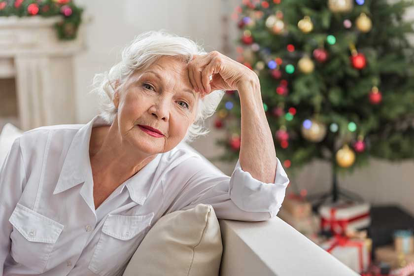 elegant senior lady is resting on couch