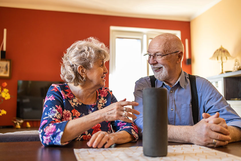 excited senior couple using virtual assistant home excited senior couple using virtual assistant home