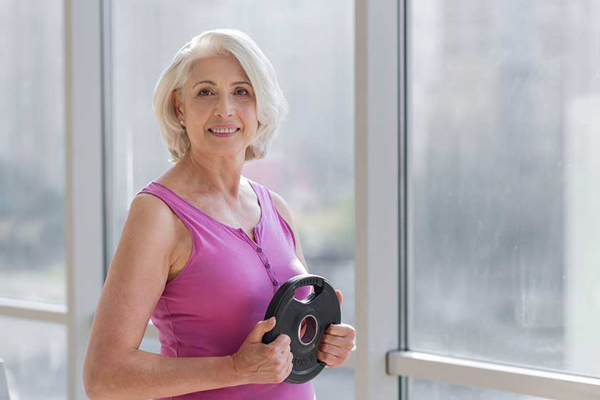 woman exercising near the window