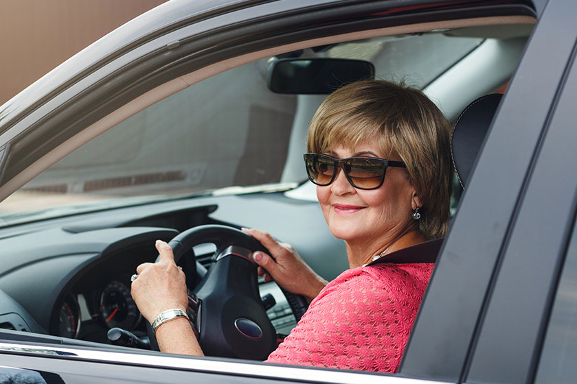 attractive mature woman in a car attractive mature woman in a car