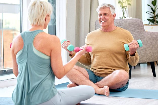 fitness elderly couple dumbbell exercise wellness muscle training mat happiness