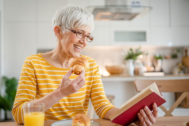 one woman mature senior caucasian female pensioner modern grandmother read