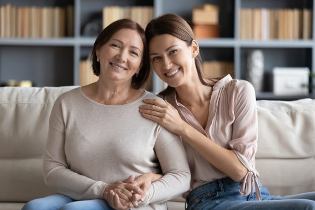 affectionate two generations family looking at camera posing for photo affectionate two generations family looking at camera posing for photo