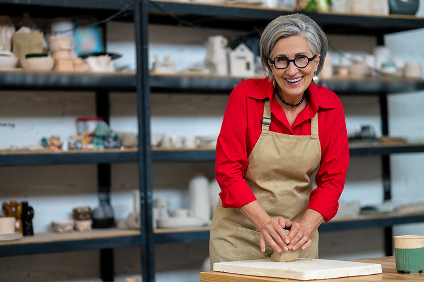 Hand kneading technique pottery mature woman wedging clay hands standing Hand kneading technique pottery mature woman wedging clay hands standing
