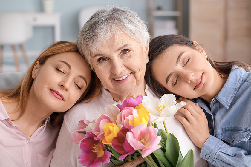 mature woman her adult daughter mother beautiful flowers home