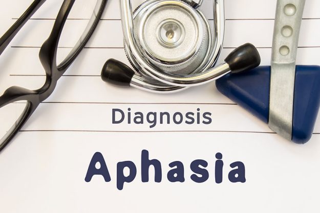 neurological diagnosis of aphasia neurological hammer stethoscope and doctors glasses lie on doctor workplace