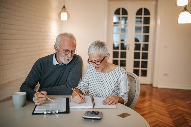 senior couple taking closer look budget comfort home senior couple taking closer look budget comfort home