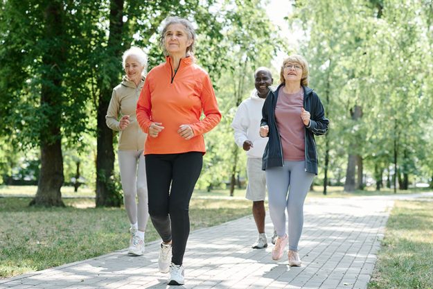 Senior people sports clothing running together morning outdoors Senior people sports clothing running together morning outdoors