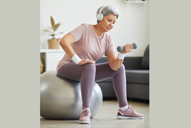 senior woman exercising with dumbbells senior woman exercising with dumbbells