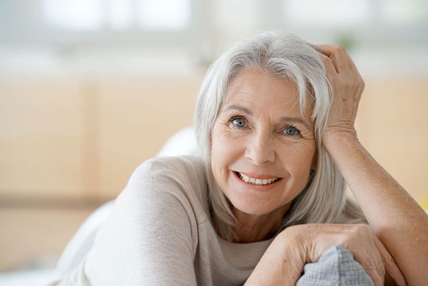 senior woman relaxing in sofa senior woman relaxing in sofa