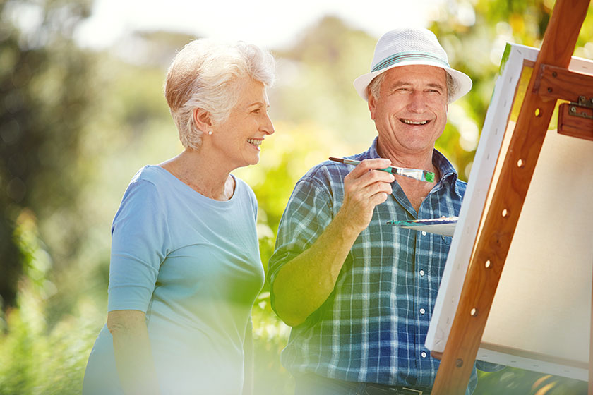 She loves watching him paint senior couple painting park