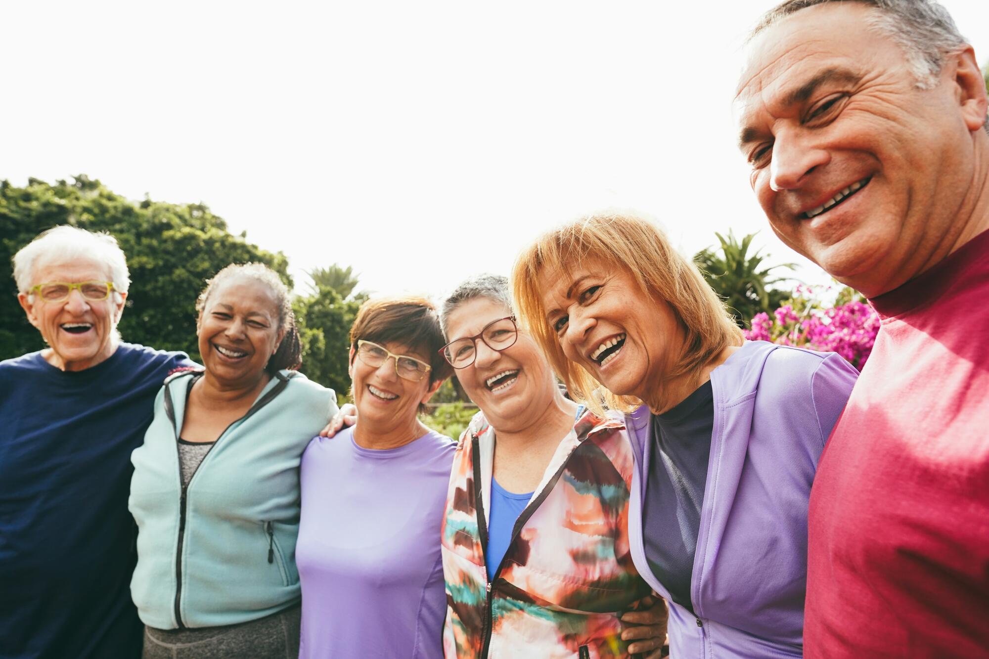 Multiracial,Senior,People,Having,Fun,Hugging,Each,Other,After,Sport Multiracial,Senior,People,Having,Fun,Hugging,Each,Other,After,Sport