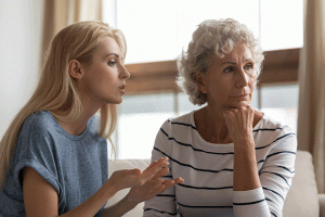 annoyed blonde grown up daughter arguing with stubborn mature mom