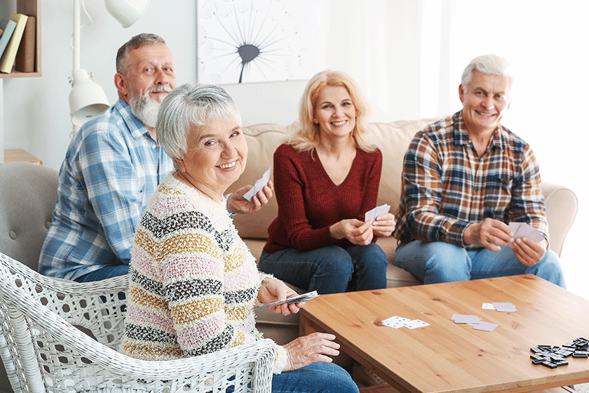happy senior people spending time together in nursing home