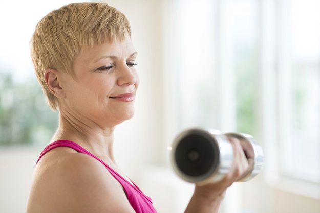 mature woman lifting weights