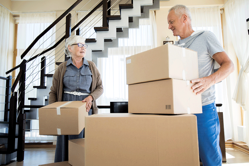 portrait happy senior couple packing cardboard boxes while moving new portrait happy senior couple packing cardboard boxes while moving new