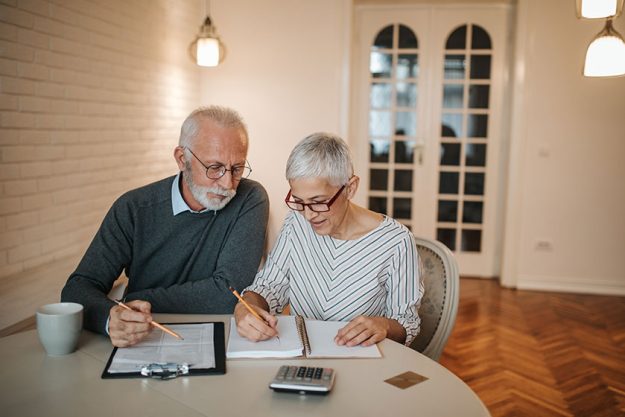senior couple taking closer look budget comfort home