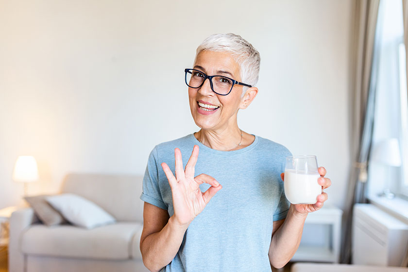 senior woman hands holding glass milk showing sign happy senior senior woman hands holding glass milk showing sign happy senior
