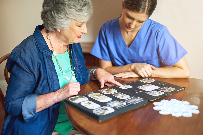 shes got plenty of photos to share shot of a resident and a nurse looking