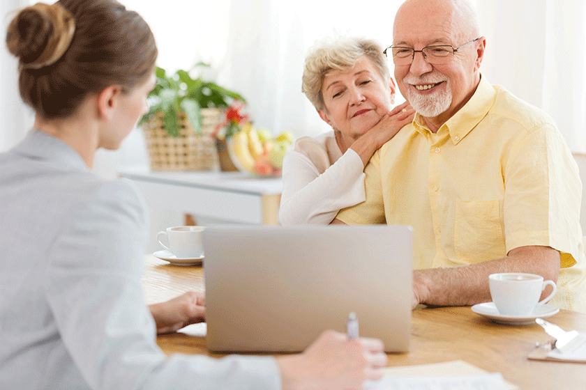 smiling elderly man woman purchasing trip travel agency