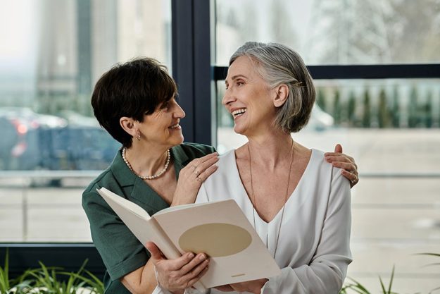two women spending time together office