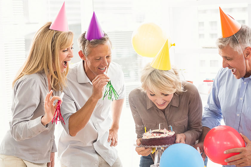 Business people celebrating birthday