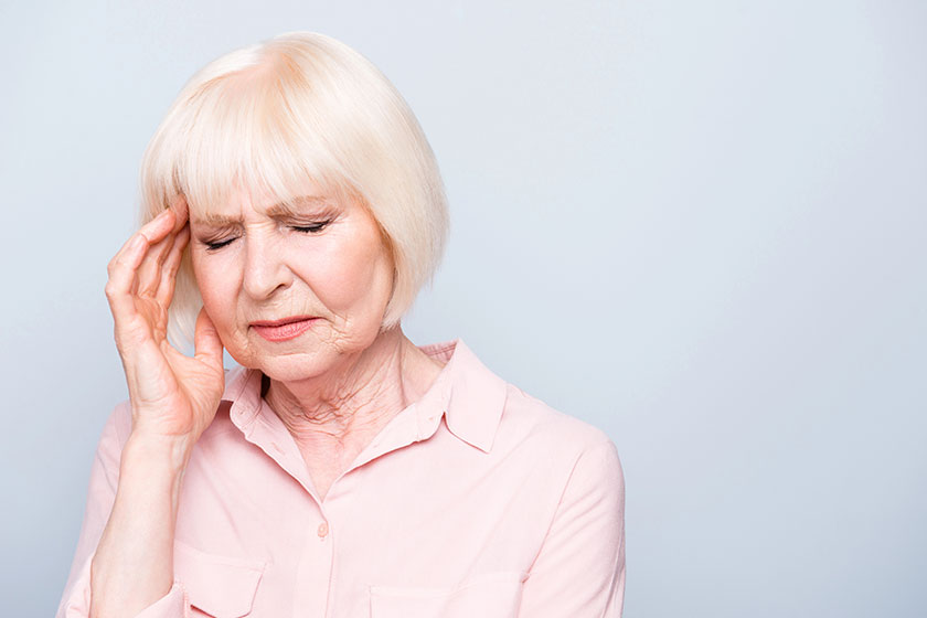 Portrait of old adult caucasian lady feeling head ache pain