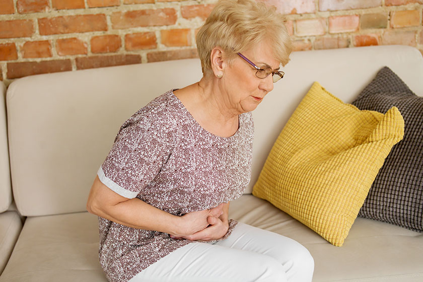 Senior woman having stomachache