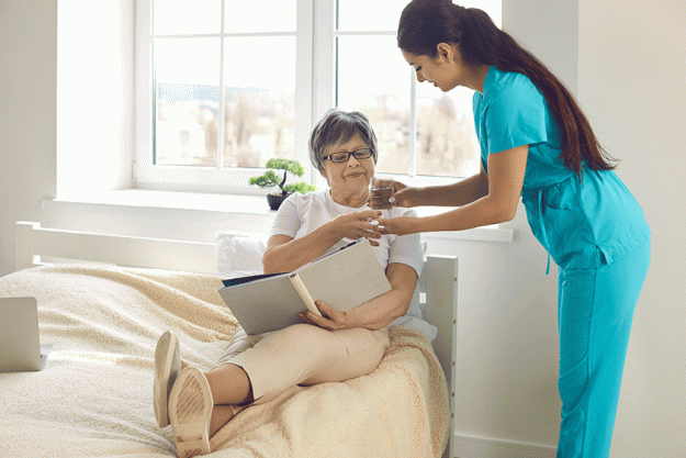 woman nurse giving prescribed pills woman nurse giving prescribed pills