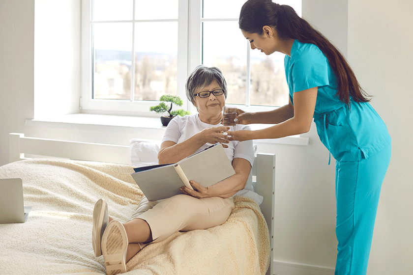woman nurse giving prescribed pills woman nurse giving prescribed pills
