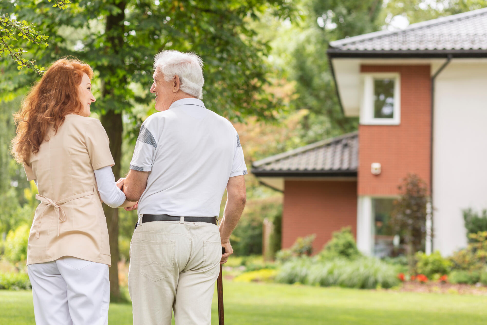 A,Back,Of,An,Elderly,Gray haired,Man,With,A,Cane