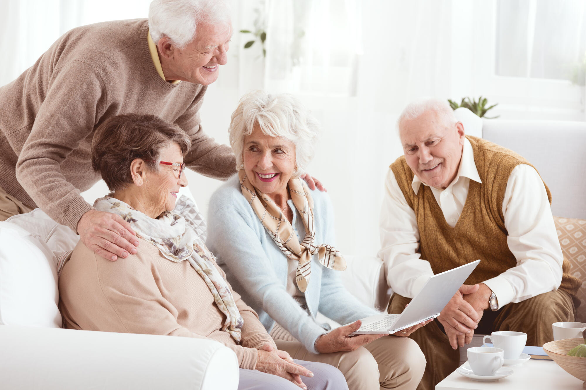Happy,Pensioners,Of,Senior,House,Using,Computer