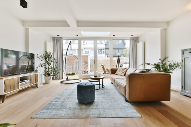 a lovely living room with a brown sofa a lovely living room with a brown sofa
