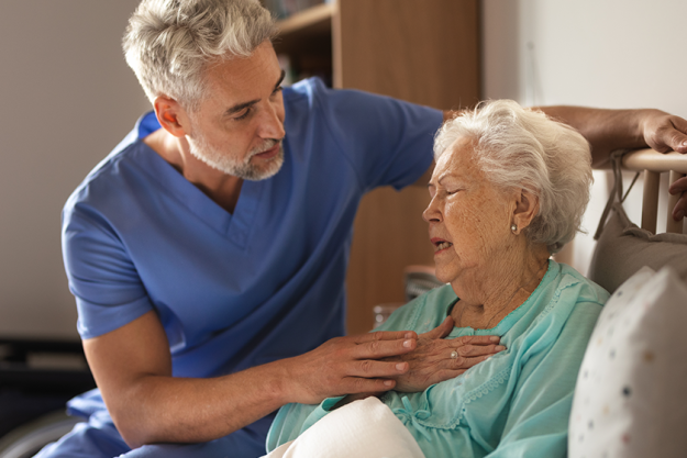 doctor helping senior patient chest pain doctor helping senior patient chest pain