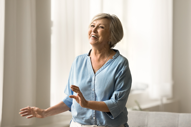 excited cheerful pretty mature woman having fun