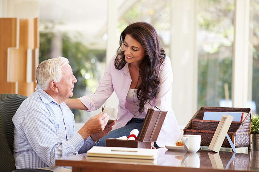 Father discussing document with daughter