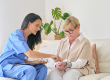 female doctor uniform checking pulse rate