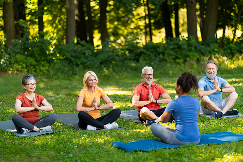 group senior people attending yoga class