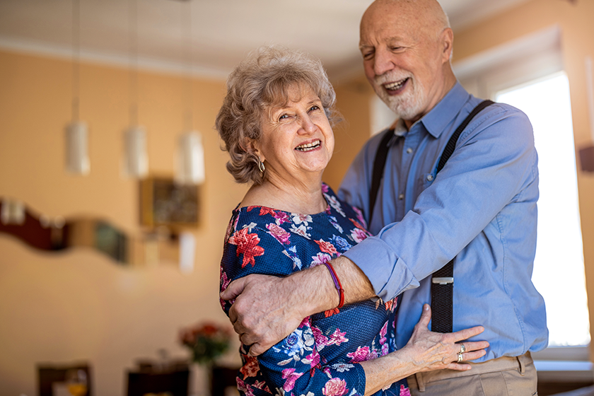 happy senior couple dancing together