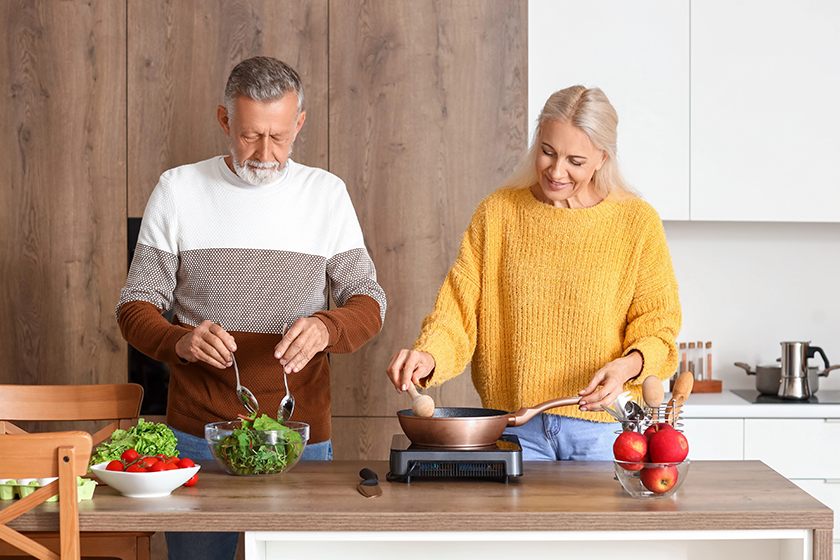 mature couple cooking