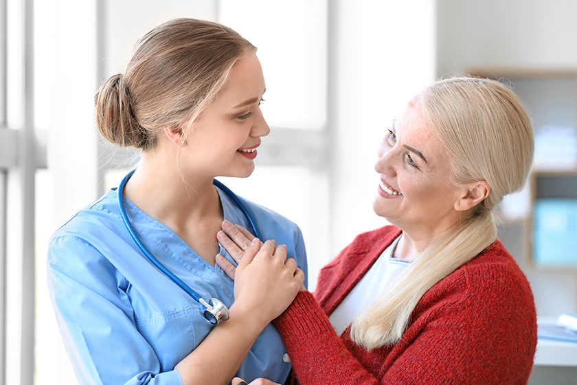 medical assistant with mature patient