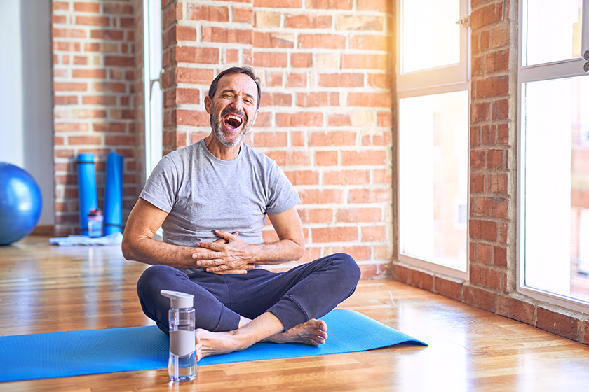 middle age handsome sportman sitting mat